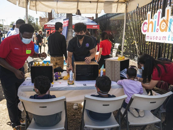 Student volunteers from the University of Arizona R. Ken Coit College of Pharmacy and Medical Directive students show kids where germs like to hide on your hands and demonstrate the importance of washing your hands well during the recent Family SciFest at Children's Museum Tucson.