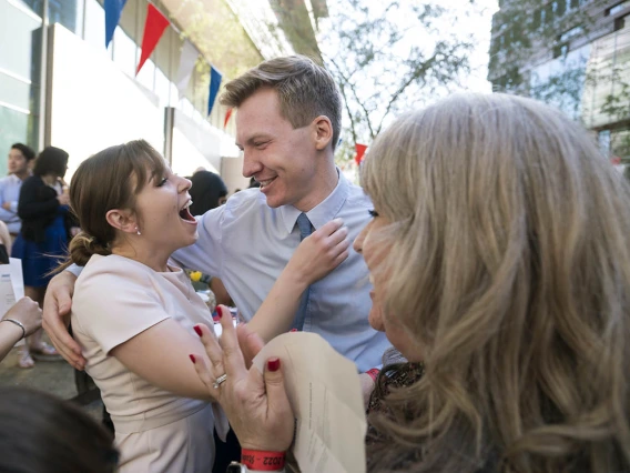 Merrion Dawson hugs classmate Alec Smith after learning of their matches during the UArizona College of Medicine – Phoenix Match Day 2022 event.