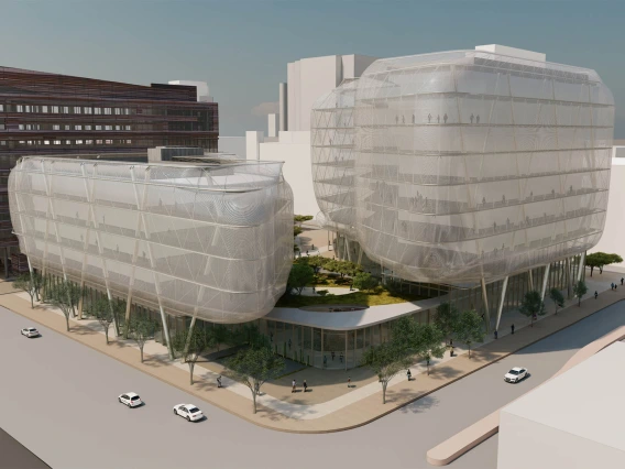 A rendering of the proposed Center for Advanced Molecular and Immunological Therapies building on the Phoenix Bioscience Core, looking at the Bioscience Partnership Building on the left. The view is from the intersection of 7th St and Fillmore.