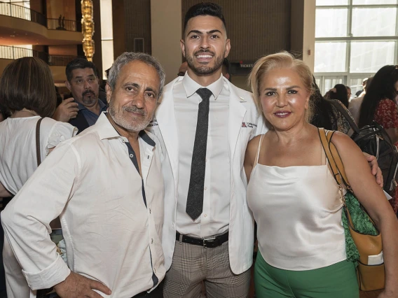 Michael Mazarei (center) poses with his father, Ali Mazarei, and mother, Minoo Ashouri, after the UArizona College of Medicine – Phoenix Class of 2026 white coat ceremony.