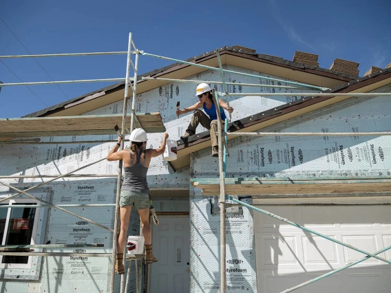 Allison Lane, MD, and Vivienne Ng, MD, MPH, both assistant professors in the Department of Emergency Medicine at the University of Arizona College of Medicine – Tucson, volunteer for the EM Day of Service at a Habitat for Humanity Tucson work site.