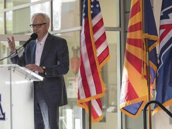 R. Ken Coit, a 1967 College of Pharmacy graduate, announces a gift of $50 million to the college during a ceremony that also renamed the college after Coit.