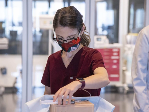 AGACNP student Chelsea Jo Cannon practices suturing during the intensive clinical skills training at ASTEC.   