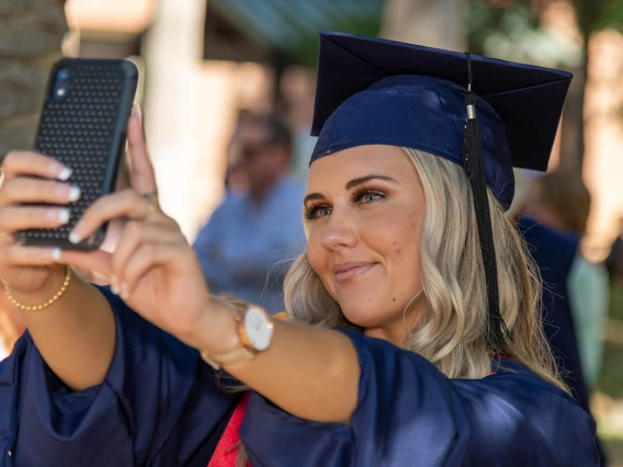 Caitlyn Bolier takes a selfie after her graduation ceremony from the College of Nursing.