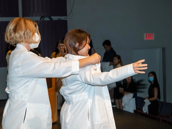 Doctor of Nursing Practice student Sherry Nguyen is presented with her white coat at the ceremony. 