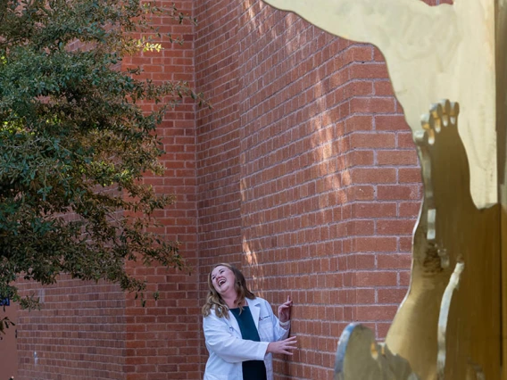 Doctor of Nursing Practice student Autumn Rhodes poses for a photo after the white coat ceremony. 