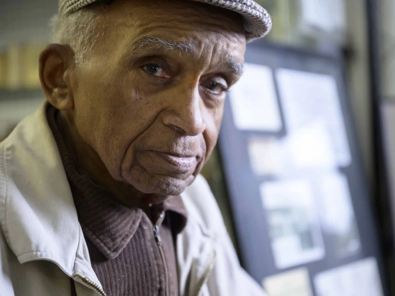 Portrait of 92-year-old Charles Kendrick wearing a flat cap. 