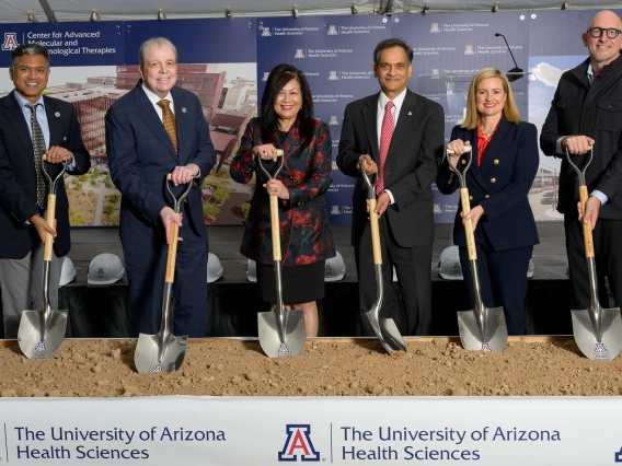 group of people pose with shovels at the groundbreaking ceremony for the Center for Advanced Molecular and Immunological Therapies