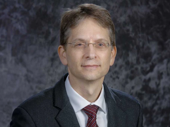 Portrait of Dr. Dedrick Jordan wearing a suit and tie