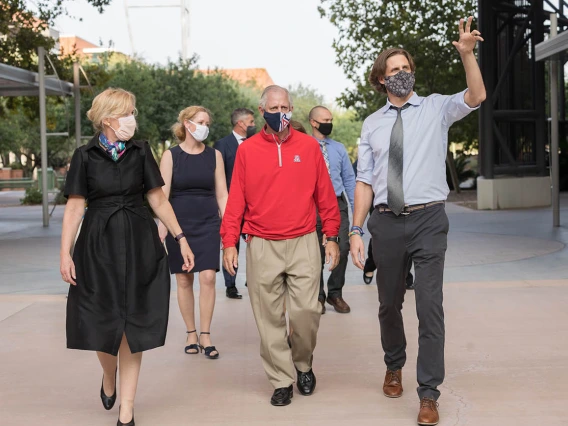 Ryan Sprissler, PhD (right), staff scientist and manager of the UArizona Genetics Core, leads Deborah Birx, MD, coordinator of the White House Coronavirus Task Force and university President Robert C. Robbins, MD on a tour of University of Arizona Health Sciences facilities on Friday, Sept. 18. Dr. Birx visited labs where researchers are conducting COVID-19 tests as part of a national tour of colleges and universities.