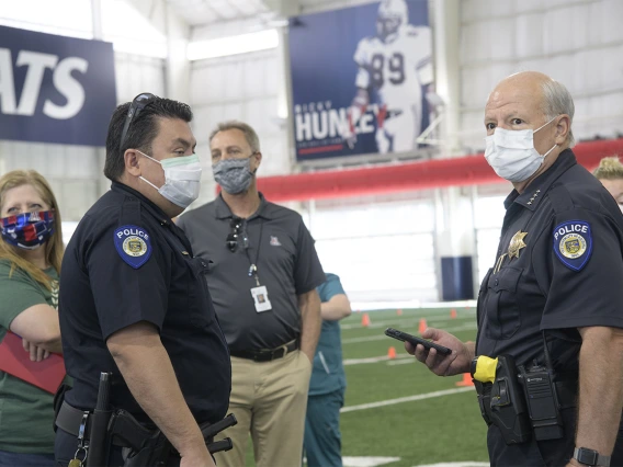 First responders and health care staff wait for their turn to be tested.