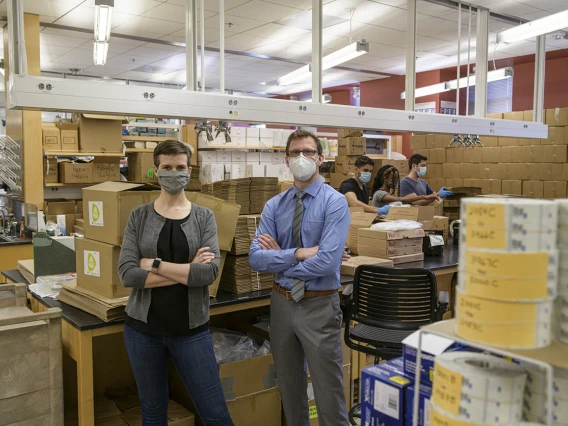 Karen Lutrick, PhD, and Shawn Bietel visited the laboratory where production of the AZ HEROES kits that are mailed to study participants each week takes place. The study was recently funded for a second year through a $15 million grant from the U.S. Centers for Disease Control and Prevention.