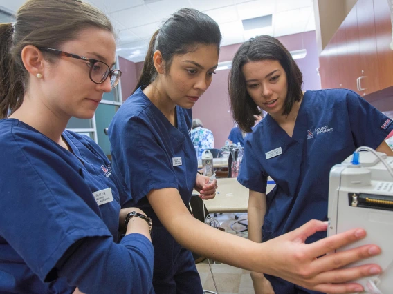 BSN students learn about medical devices in a classroom environment in 2018.