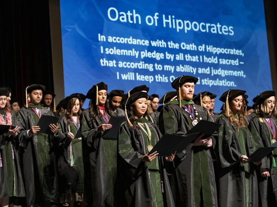 College of Medicine-Tucson graduates recite the Hippocratic Oath near the end of their College of Medicine – Tucson class of 2022 convocation ceremony at Centennial Hall. 