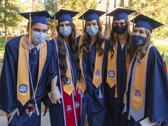 College of Nursing students (from left) Matthew Pelzek, Sophia Penuela, Sophia Piazza, Alicia Rivera and Anika Schickling pose fora photo before the start of the December convocation. 