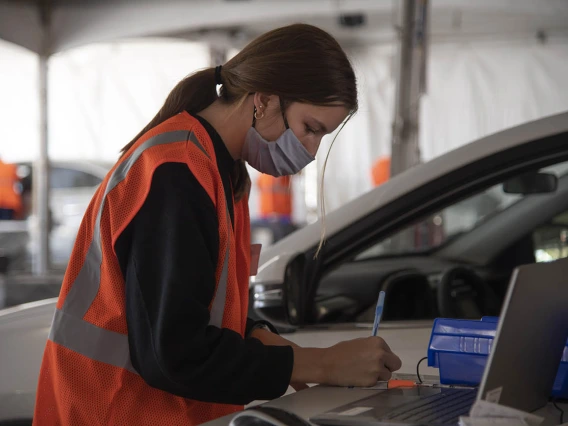 College of Nursing student Paige Foley volunteers as a scribe at the Pima County POD on the UArizona campus.