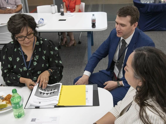 Ophelia Spencer, Ben Brady, PhD, and Alyssa Padilla discuss the UArizona Health Sciences Comprehensive Pain and Addiction Center’s paraprofessional training programs, Project FUTRE and PeerWORKS, during a luncheon for community partners.