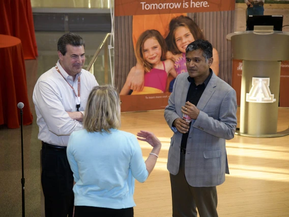 (From left) Mark Lane, former associate vice president of communications for UArizona Health Sciences, and his wife, Faith, talk to Deepta Bhattacharya, PhD, professor of immunobiology in the University of Arizona College of Medicine – Tucson, after his presentation at the first Tomorrow is Here Lecture Series event in Tucson. 