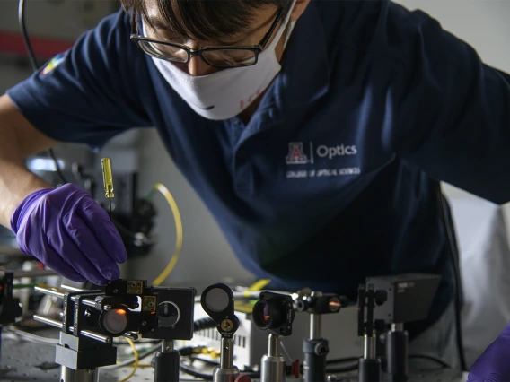 Dongkyun Kang, PhD, works on the laser light portion of a new, portable skin cancer diagnostic technology he is developing with Clara Curiel-Lewandrowski, MD.