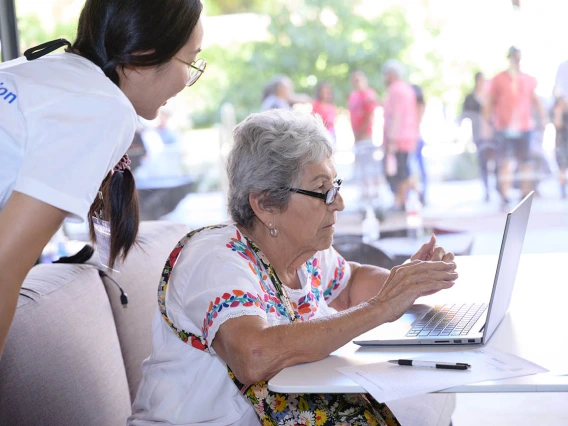 (From left) Gabby Wen, a graduate research assistant in the Mel and Enid Zuckerman College of Public Health, helps Bobbie Herrera as she prepares to take the MindCrowd memory test during the Feast for Your Brain community event on Sept. 10.