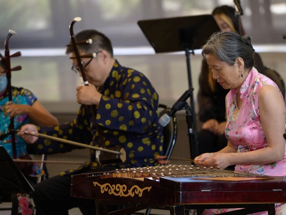 Members of the University of Arizona Asian Music Club’s Purple Bamboo Ensemble perform during the  Feast for Your Brain community event on Sept. 10 in the Forum of the Health Sciences Innovation Building.