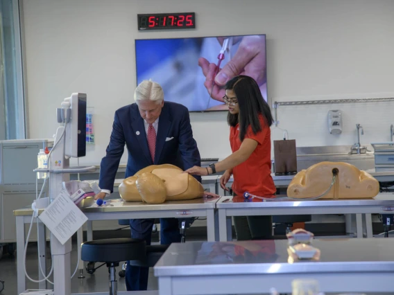 Examining a manikin on the ASTEC simulation area on the seventh floor.