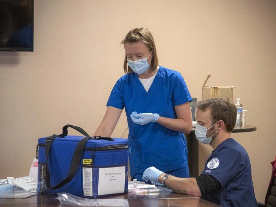 College of Nursing vaccinators prepare vaccines for a COVID-19 clinic hosted April 23 by UArizona Health Sciences and Cochise County Health Department at the Mexican Consulate in Douglas, Arizona.