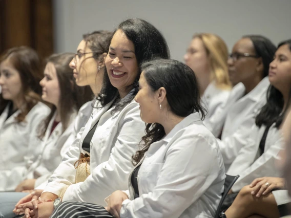 Primary Care Physician scholarship recipient Kaloni Philipp shares a moment with fellow scholarship recipient Anna Ressel.