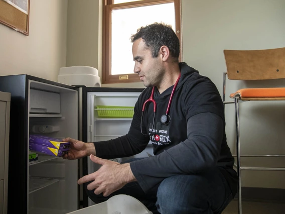 Street Medicine Phoenix co-founder Jeffery Hanna grabs vaccines from the fridge on campus before heading to Grace Lutheran Church for the February 23, 2020 street run.