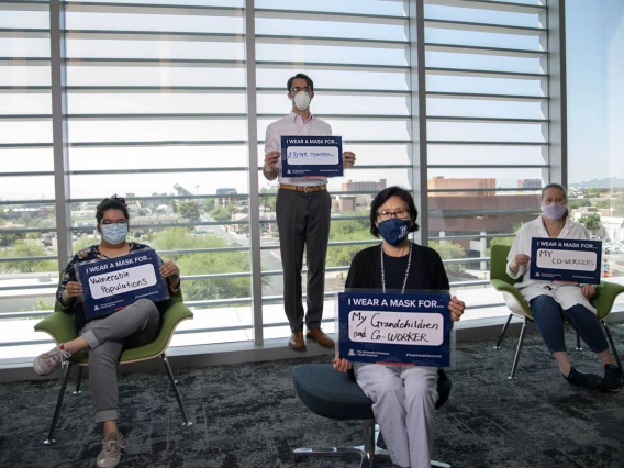 Nicole Delatorre, Alex Thome, PhD, Shuhua Chen and Lucia Whitman, PhD, from the Center for Innovation in Brain Science share their inspiration in the UArizona Health Sciences “I Wear a Mask” campaign.