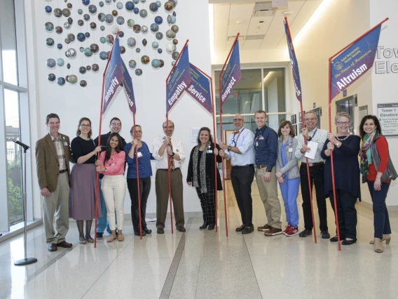 From left: Kevin Moynahan, MD, Dilara Onur (third-year medical student and Gold Humanism Honor Society inductee), Tyler Kennedy (fourth-year medical student), Natalie deQuillfeldt (third-year medical student and winner of poetry slam), Rachel Cramton, MD, Andreas Theodorou, MD, Noshene Ranjbar, MD, Josh Lee, MD, Joshua Gormley (third-year medical student), Darien Allen (fourth-year medical student and Gold Humanism Honor Society member), Richard Wahl, MD, Nancy Koff, PhD, and Violet Perez Siwik, MD.