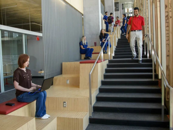 Study areas are nestled along a staircase that spans the east side of the building, making it easy to find a place to work alone or with a small group, aided by plenty of natural light.