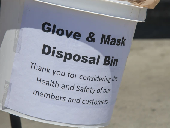 A glove and mask disposal bin in a Food City grocery store in Tucson, one of many changes grocery stores have implemented to help protect public safety in the pandemic. The store is also hanging posters designed by College of Medicine – Tucson students to help encourage masking, social distancing and hand washing.