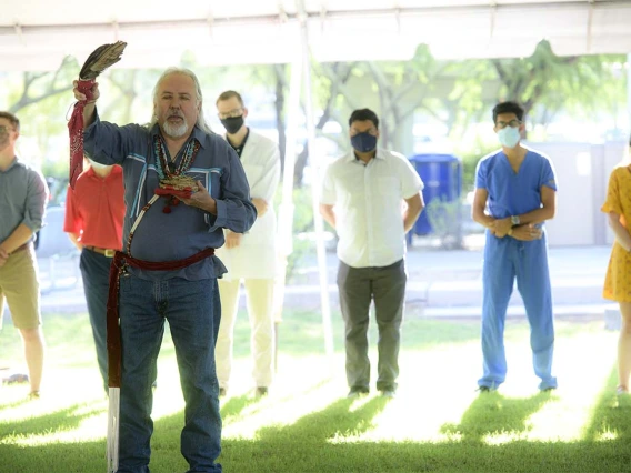 Dr. Carlos Gonzales performs the Blessing of the Seven Sacred Directions during the annual College of Medicine – Tucson Tree Blessing Ceremony. 