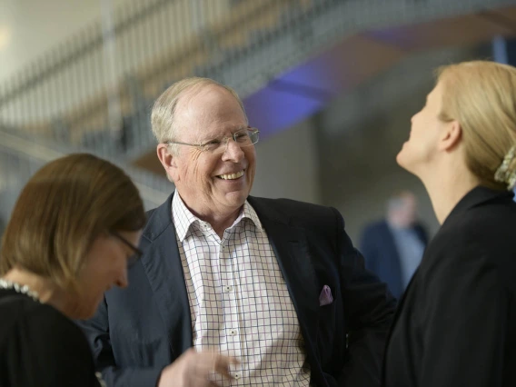 Attendees mingle inside the Health Sciences Innovation Building after the town hall event, Jan. 28, 2020. 