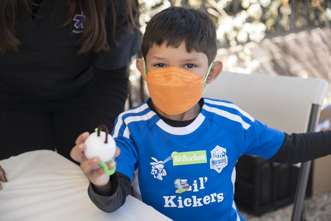 Jay Mendoza holds a virus he made out of a foam ball and pipe cleaners during the recent Family SciFest at Children's Museum Tucson.