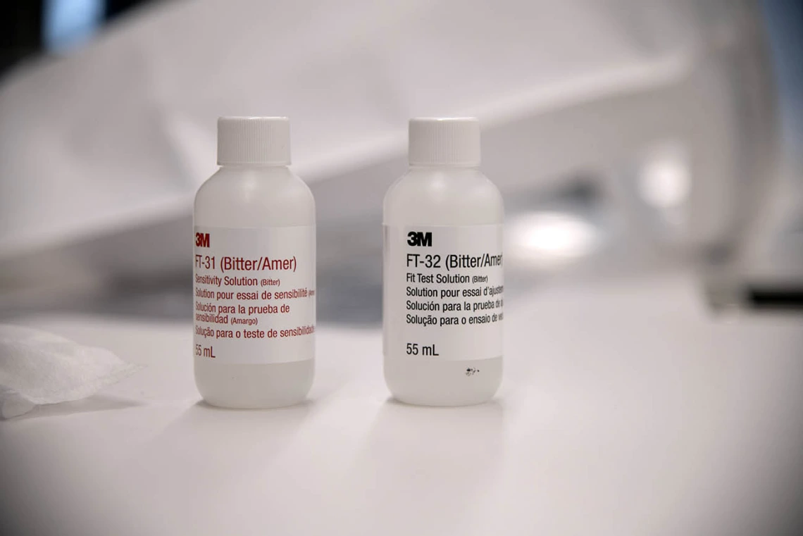 Bitters are used during the fitting in what is called the “sensitivity check.” If a student can taste them while wearing an N95 mask under the hood, the equipment is not properly fitted and must be further adjusted. 