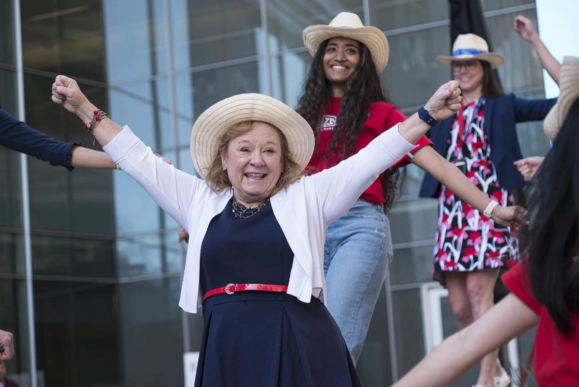 Kelly Lynch (center), alumni/student relations manager at College of Medicine – Phoenix, along with faculty, staff and medical students surprise the class of 2022 with a dance before the start of the Match Day event.