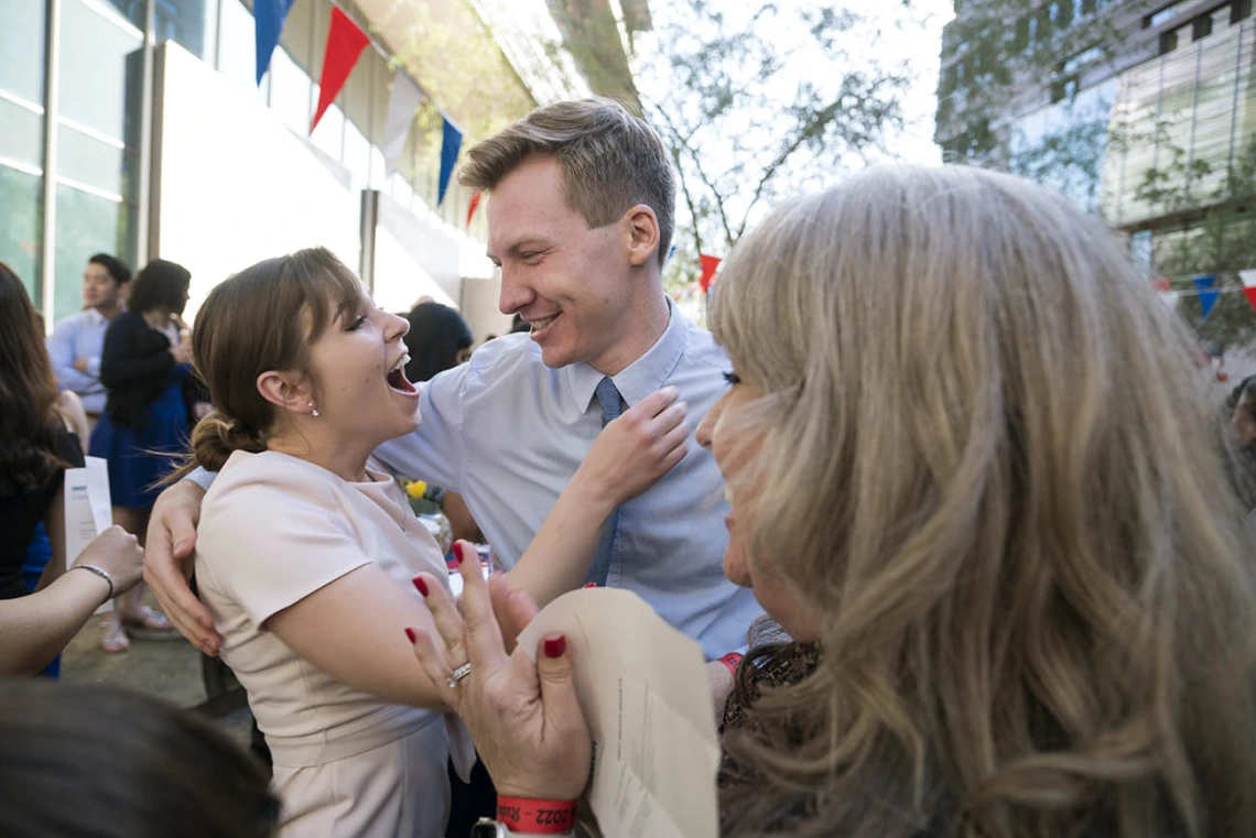 Merrion Dawson hugs classmate Alec Smith after learning of their matches during the UArizona College of Medicine – Phoenix Match Day 2022 event.