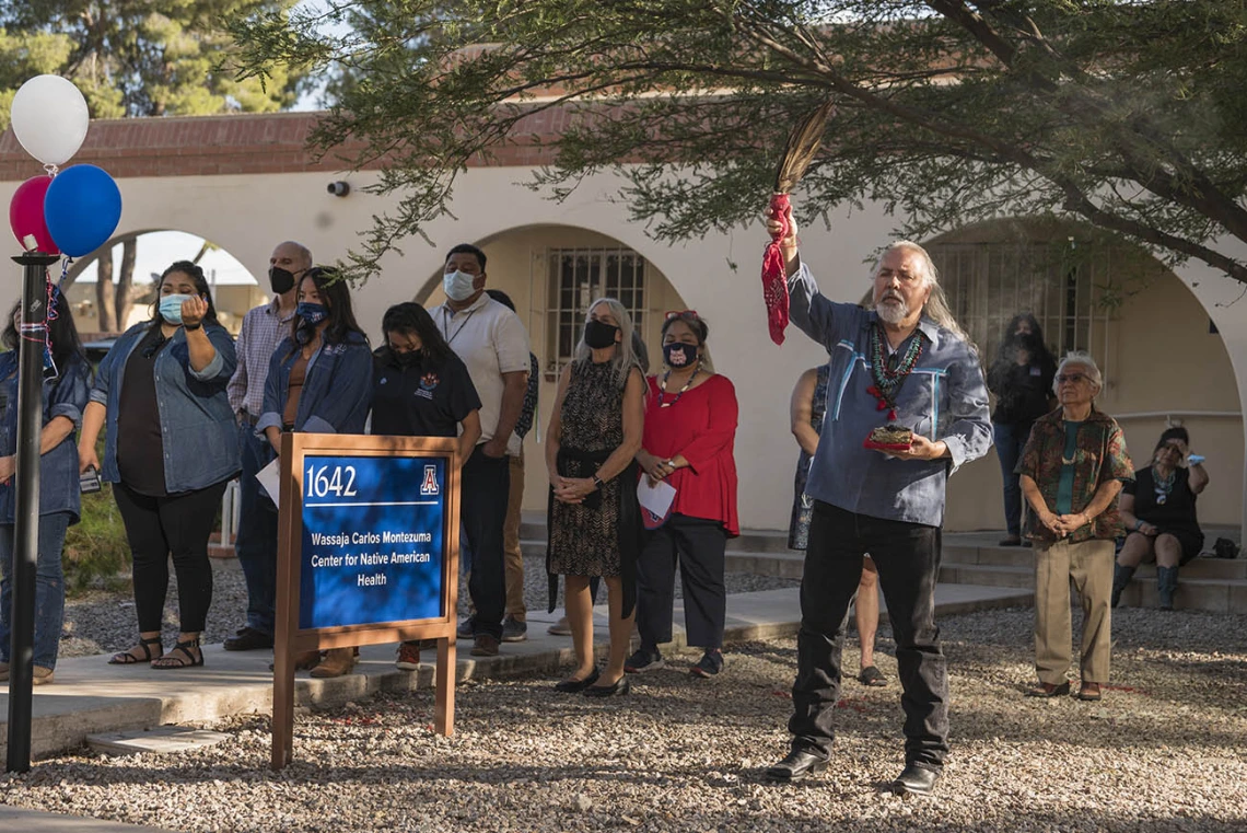 Carlos Gonzales, MD, assistant dean of curricular affairs, associate professor of Family and Community Medicine, and advisor for Traditional Indian and Western Medicine Collaboration, says a prayer to the Seven Sacred Directions during the renaming ceremony.