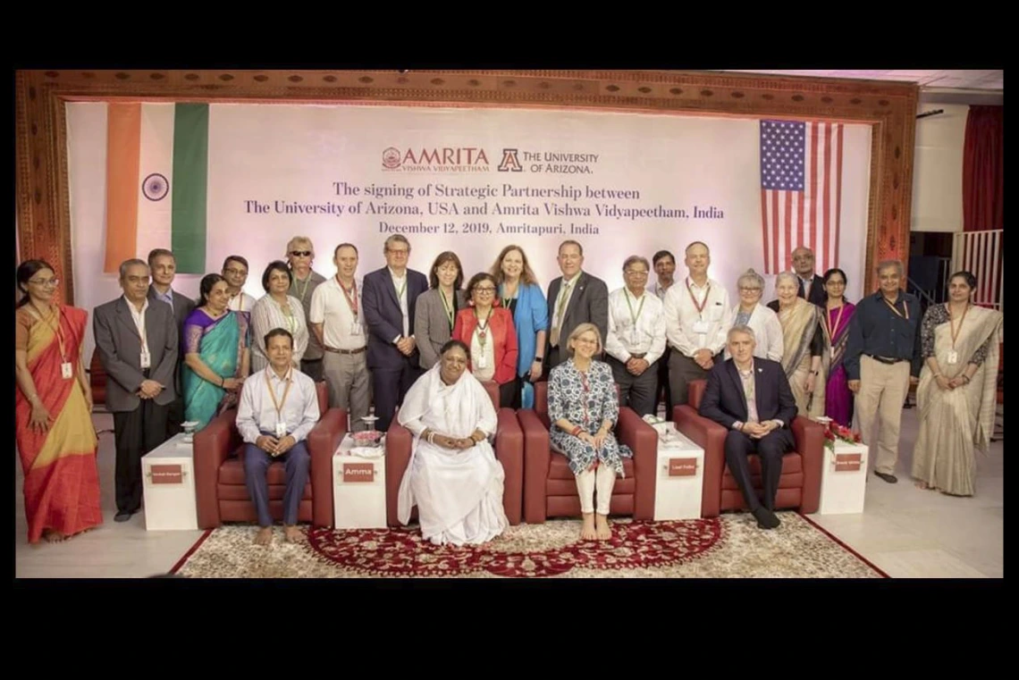 Members of the Global Health Institute attend a 2019 signing ceremony for a partnership between the University of Arizona and Amrita University in Amritapuri, India.