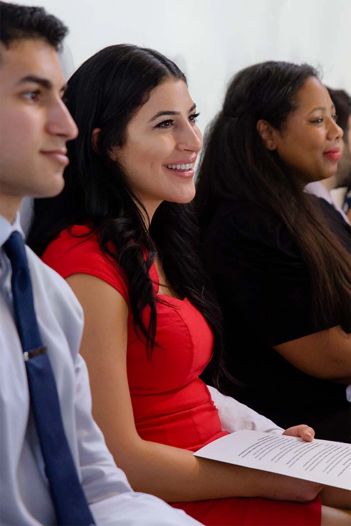 Daniel Oheb, Daniela Parga and Jade Parker-Character listen to speakers during the ceremony.