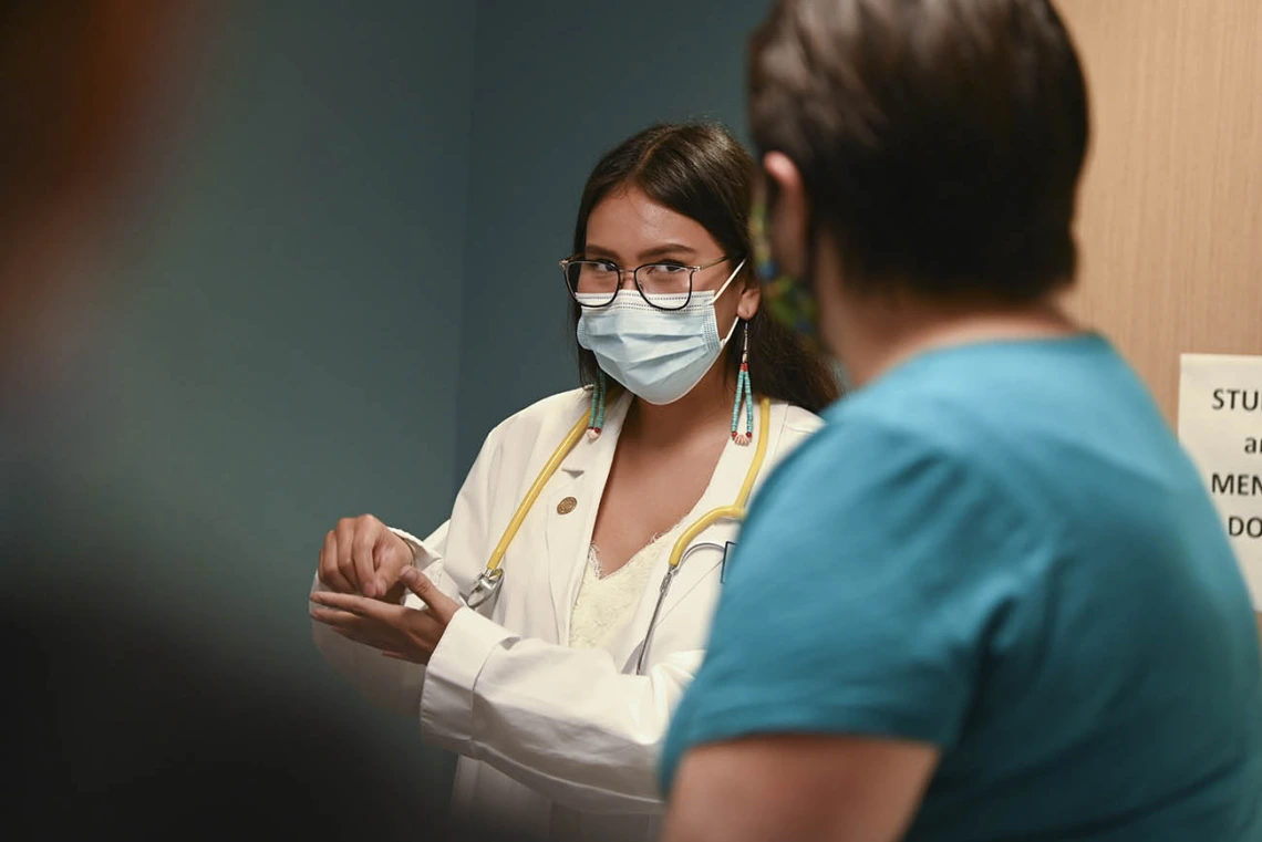 Health Sciences intern, Sophia Murphy, role-played as a doctor, practicing clinical skills with a patient, during the field trip.