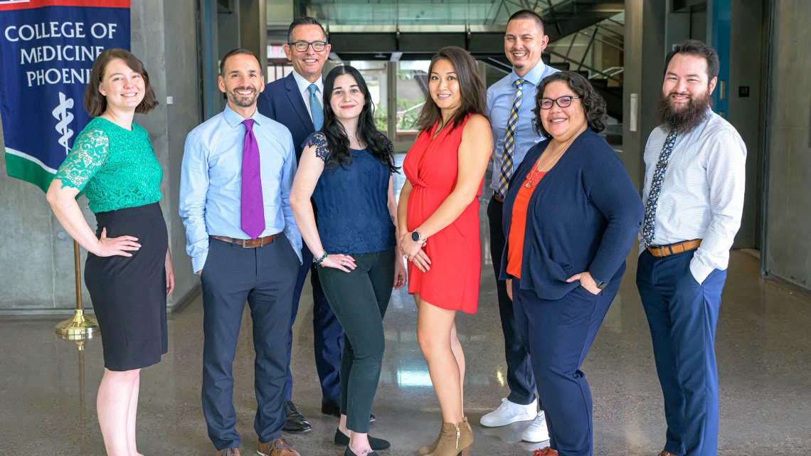 Glen Fogerty, PhD, MBA (third from left), College of Medicine – Phoenix admissions and recruitment associate dean, with his admissions team (L-R): Alex Hughes, Mark Priolo, Dr. Fogerty, Enjoli Pescheta, Julie Chiu, Chip Young, Shari Carbajal and Sam Blair.