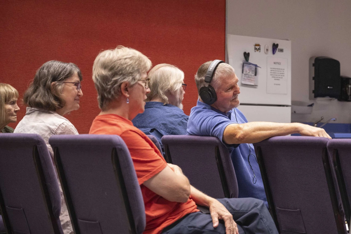 Four people, including Mel Hector, MD, of the University of Arizona’s College of Medicine – Tucson, watch a reading of Hector’s play.