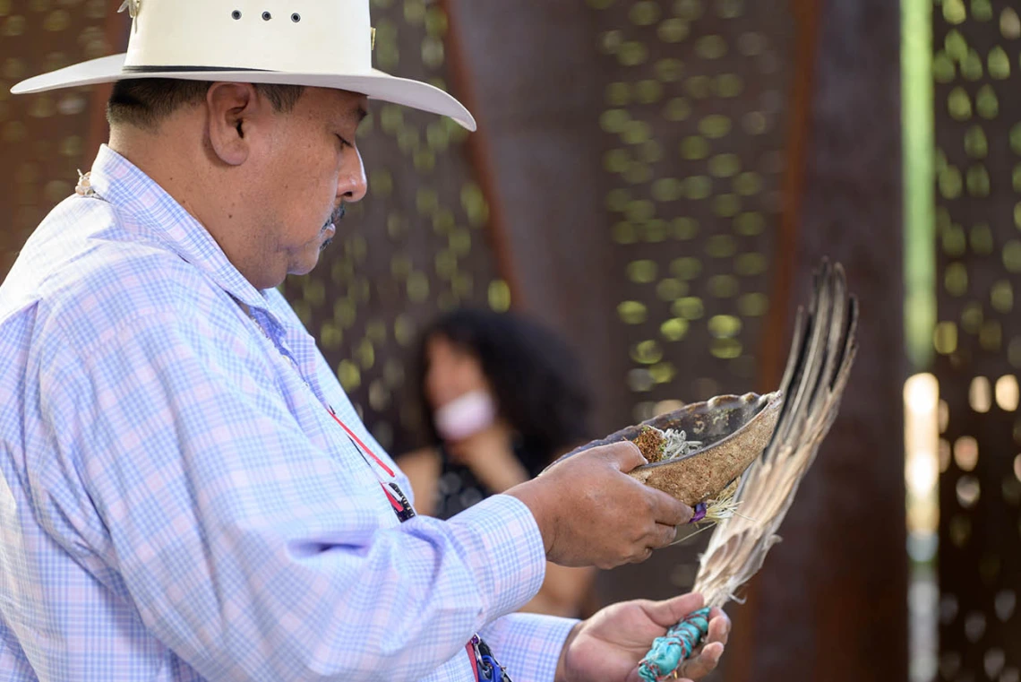 Miguel Flores Jr., a Native American traditional healer from the Pascua Yaqui and Tohono O’odham tribes, prepares to lead the blessing ceremony at the Phoenix Bioscience Core.