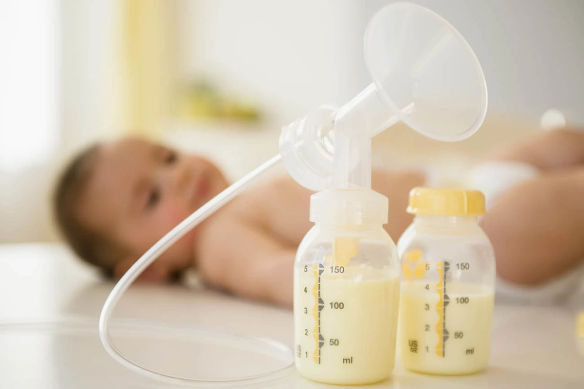 Breast pump next to baby