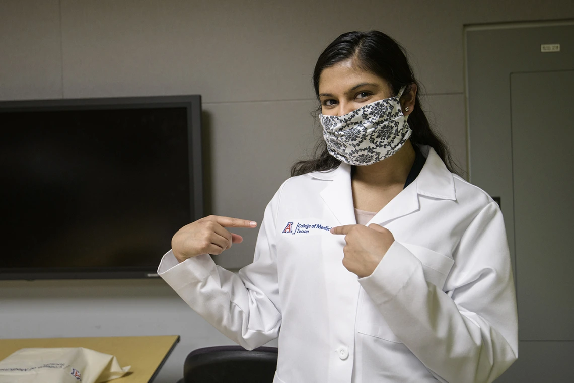 First-year medical student Maithili Khandekar proudly displays her white coat.