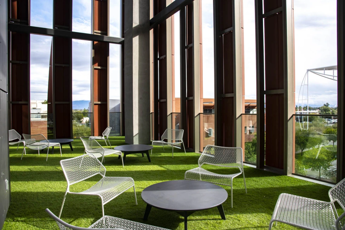 Outdoor spaces on the upper floors of the building offer covered, panoramic views and access to natural elements.