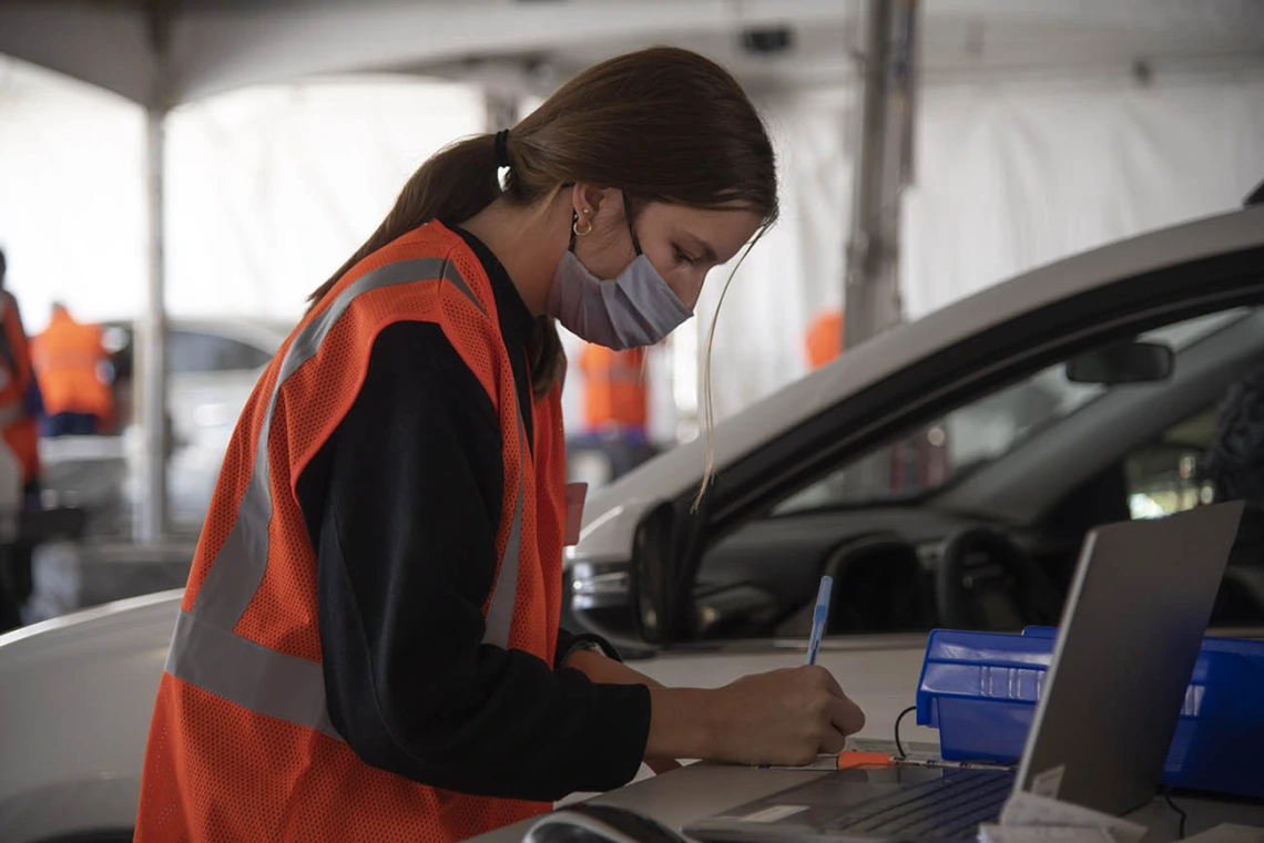 College of Nursing student Paige Foley volunteers as a scribe at the Pima County POD on the UArizona campus.